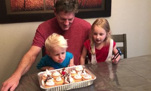 Kid Blows Out Dad's Candle