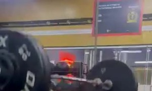 Woman Exercising Drops Weight Bar on Herself