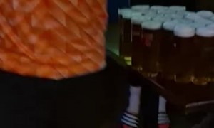 Dutch Fan Carries Arm-Load of Beer to Table