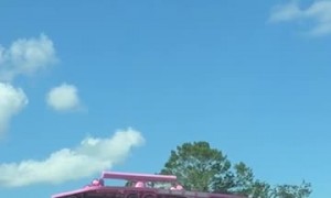 Bright Pink Boat Turns Heads on Florida Highway