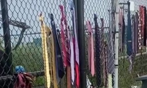 Security Removes Father's Day Ties at Detention Facility