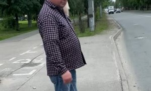 Man Walking a Toy Dog