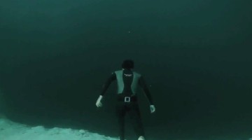 A Man Jumps Into A 700ft Underwater Chasm