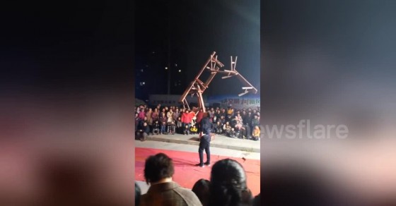 Chinese acrobat lifts up seven benches stacked onto his mouth - Sharedots