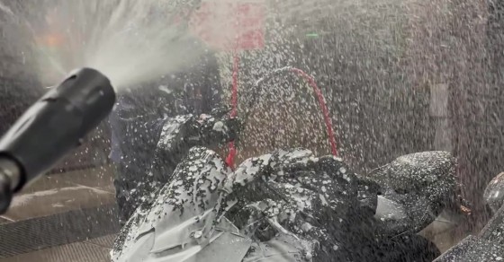 Biker Getting Sprayed in a Car Wash - Sharedots