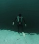 A Man Jumps Into A 700ft Underwater Chasm