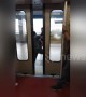 Furious passengers kick their way out of jammed train door