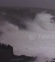 Huge swells and crashing waves in Cornwall as villagers look on