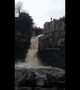 Adrenaline junkie flings self down waterfall during UK floods