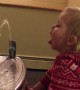 Cute Little Girl Can\'t Figure out Drinking Fountain