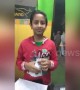 The incredible moment an Indian boy lights up a light bulb with just his bare hands