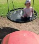 Ingenious father backs up lawn mower to push daughter on swing