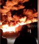 Dramatic footage shows roaring flames and massive smoke flumes as warehouse catches fire in northeast Chinese city