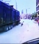 Scooter driver narrowly escapes being run over by lorry