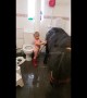 Three-year-old takes pony into the bathroom for a warm shower