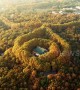 This drone footage of fall foliage enveloping Nanjing\'s Meiling Palace is beautiful