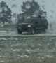 Driver Fishtails on I-80 in Snowy Conditions