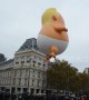 Trump baby blimp joins thousands at Paris protests