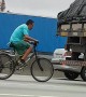 Bicycle Catches a Ride Behind Truck