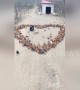 Creative farmer spreads feed to make chickens form heart-shaped pattern