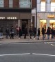 Shoppers queuing on Oxford Street for shoe sales during Black Friday
