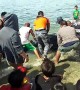 Half-tonne endangered turtle is helped back into the sea after being freed from fishing net