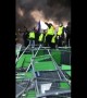 Fuel tax protesters light fire on Champs-Elysées in Paris