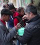 Footage shows local Tijuana shop owner serving food to Honduran migrants