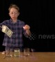 Young scientist sets dollar bill on fire with mystery solution