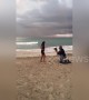 Boyfriend makes surprise beachside proposal under a rainbow