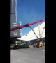 Men left hanging metres in the air after crane falls in freak accident