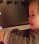 Little Girl is Amazed by her Glowing Christmas Tree