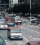 Girl falls out of three-wheeler onto busy road