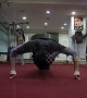 Excruciating feat of endurance as man does 2-finger push-ups with 50kg weight