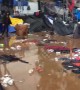 Tijuana migrant shelter a muddy mess as rain pours down