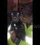 Chihuahua not at all happy to be getting kisses from his daddy