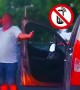 Driver stopped for speeding steps out of car on the phone