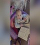 Adorable Baby Pretends to Read Newspaper