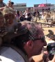 Cheeky monkeys jump onto photographer\'s head