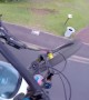 Daredevil cyclist uses car to boost speed in spectacular jumps