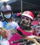 Lizard and two dogs wearing sunglasses pose for photos while on motorbike