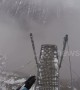 Man dives into the abyss wing-suiting through foggy Swiss valley