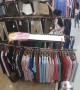 Thief steals clothes while shop assistant too busy doing her makeup to notice