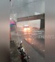 Bus drives through submerged highway during torrential floods in Indonesia