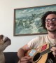 Bulldog sings along with guitar playing own