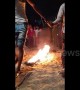 Man pours kerosene on line of fire before walking barefoot over it