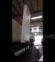 Worker lifts up and balances tower of 18 foam blocks