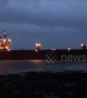 Russian cargo ship stranded on UK beach during low tide