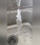 Water running out of tap freezes solid in midair in northern China