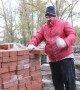 Man Breaks Bricks By Hand